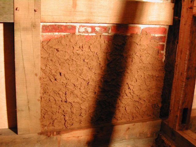 Lehm an die Wand